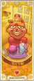 Carta oficial de tarô de Burgerpants como Page of Wands.[1]